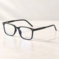 Plemea Classic Day blue light glasses in glossy black, rectangular frame with clear non-prescription lenses