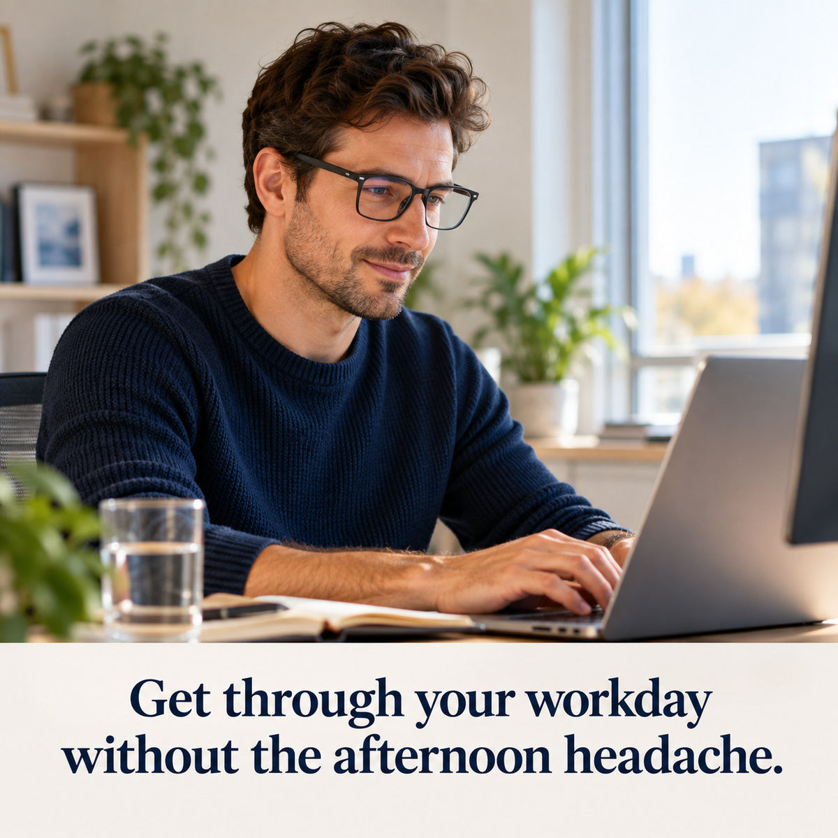 Man working at his home office desk wearing Plemea Classic Day clear-lens blue light glasses