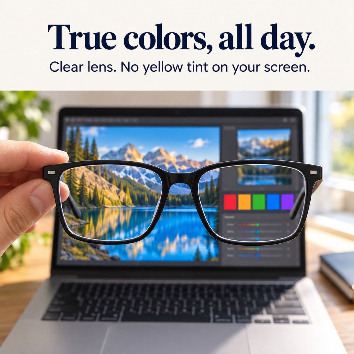 Plemea Classic Day glasses held in front of a laptop: the clear lens keeps screen colors true, with no yellow tint