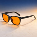Plemea Classic Night blue light glasses, glossy black rectangular frame with amber-tinted lenses