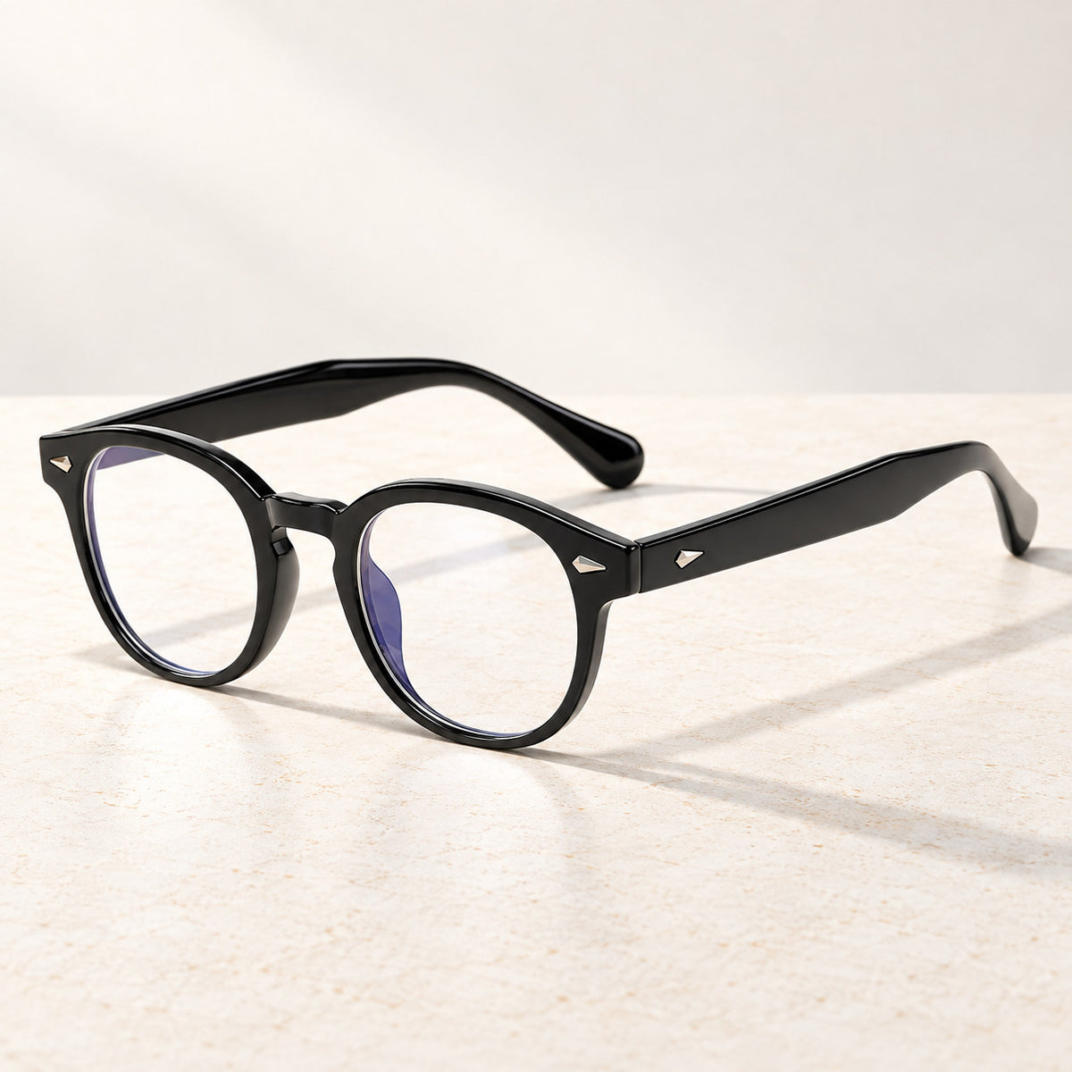 Plemea Retro Day blue light glasses in a solid black round frame with clear lenses